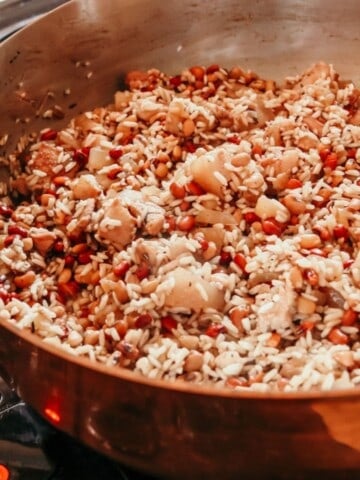 closeup of Hoppin' John cooking in a copper saucier