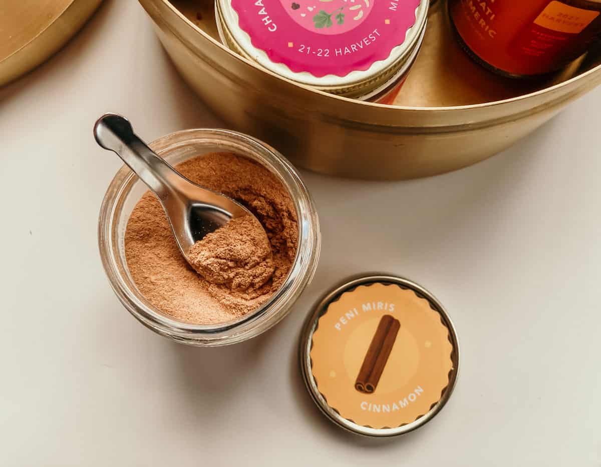 closeup of peni miris cinnamon and a spice spoon from Diaspora Co
