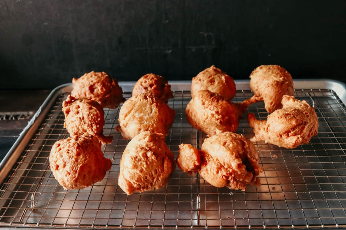 fried drop biscuits cooling on a rack