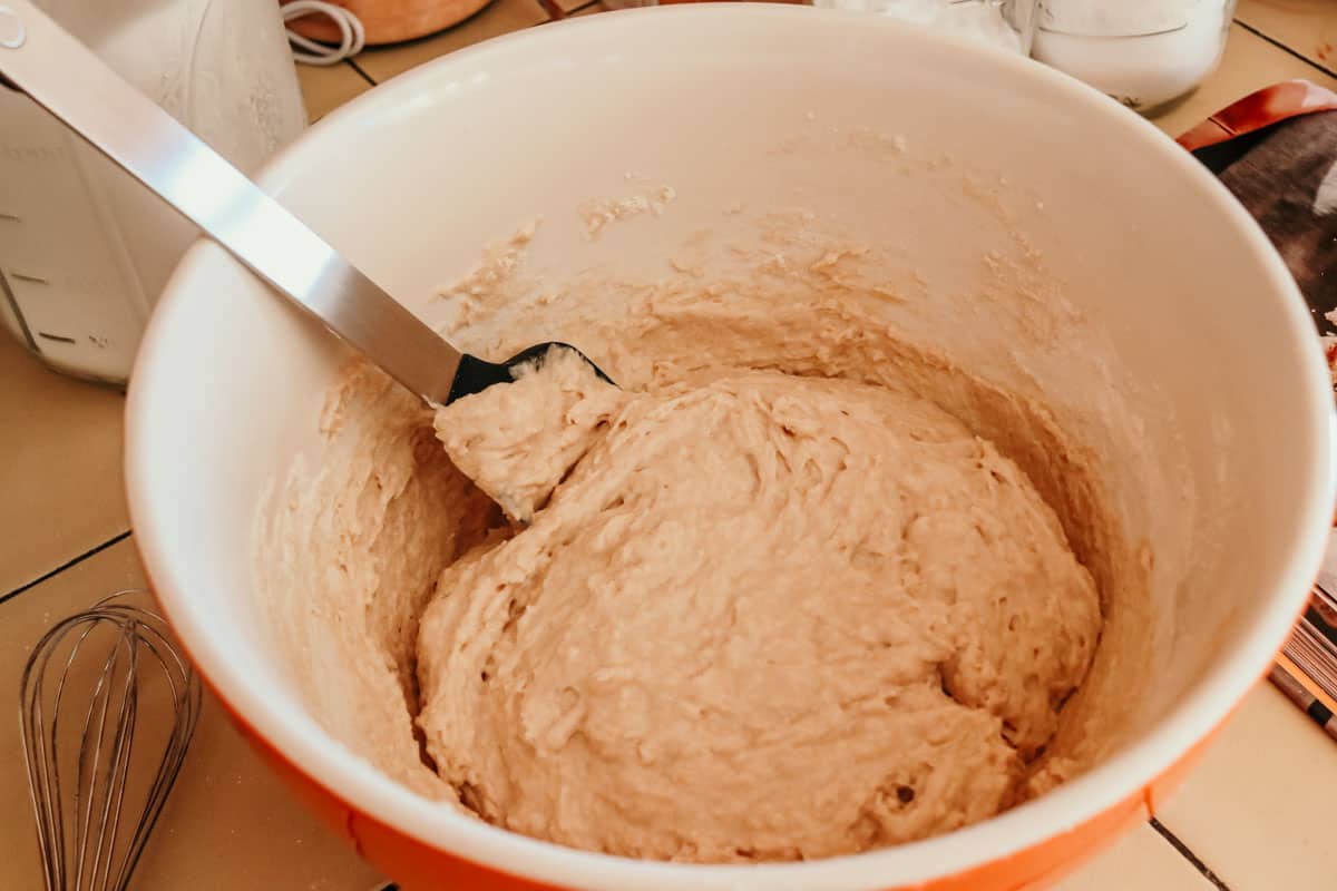 dough for making deep-fried drop biscuits in a bowl with a spatula
