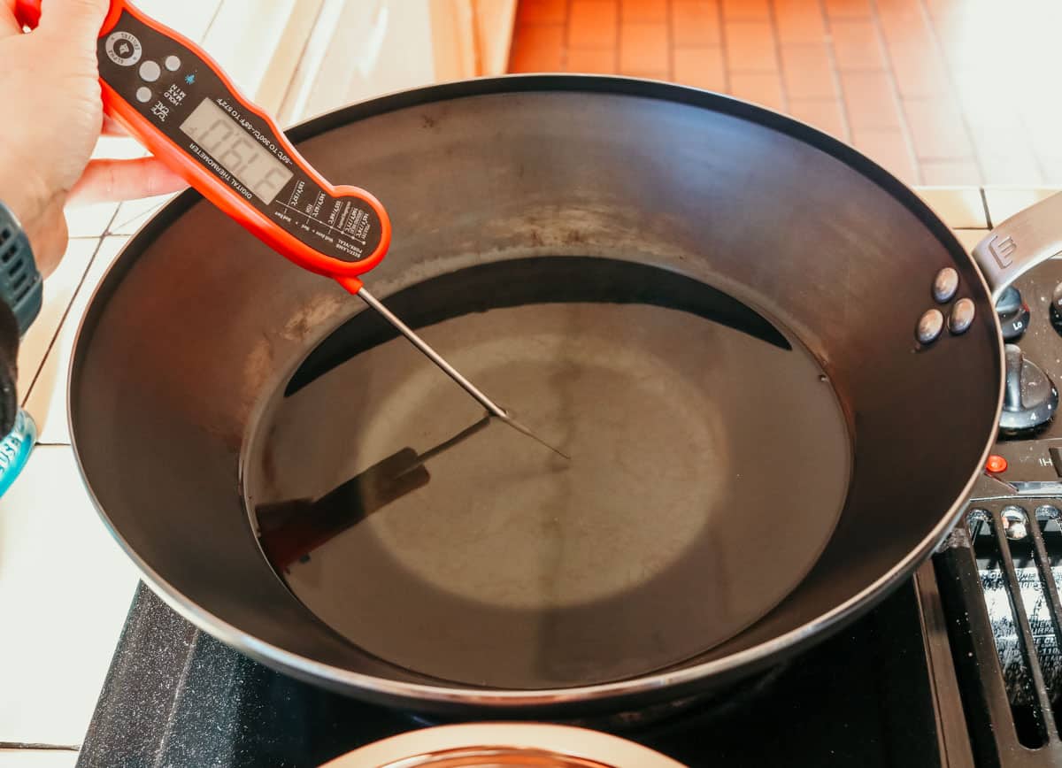 kitchen thermometer in a wok with oil