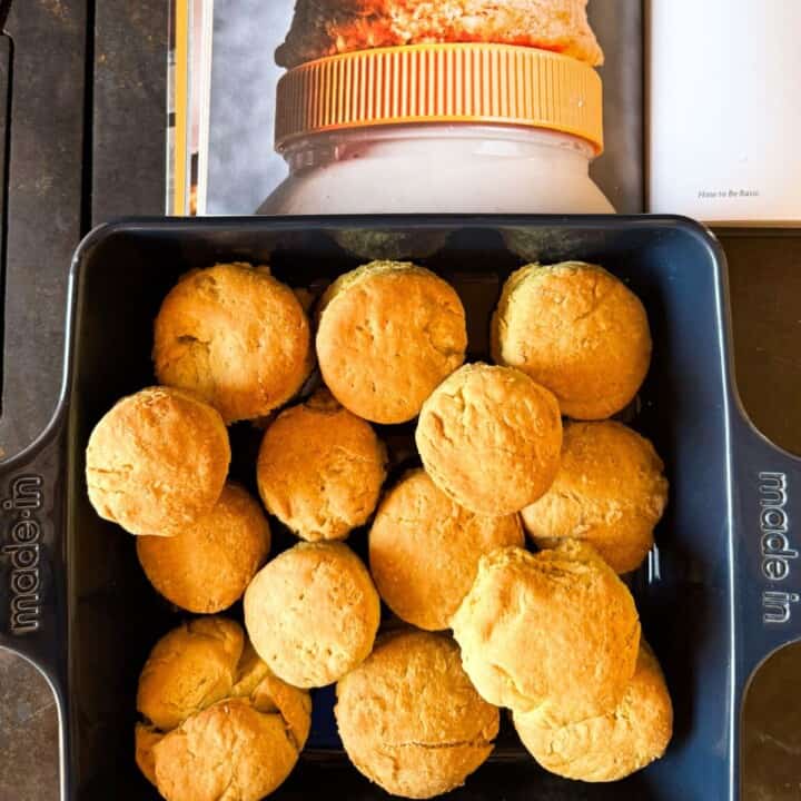 Mayo biscuits and Still We Rise cookbook open to Duke's Mayo Biscuit recipe